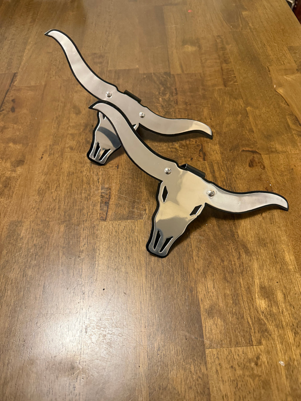Long horn cow skull strut and coil plates